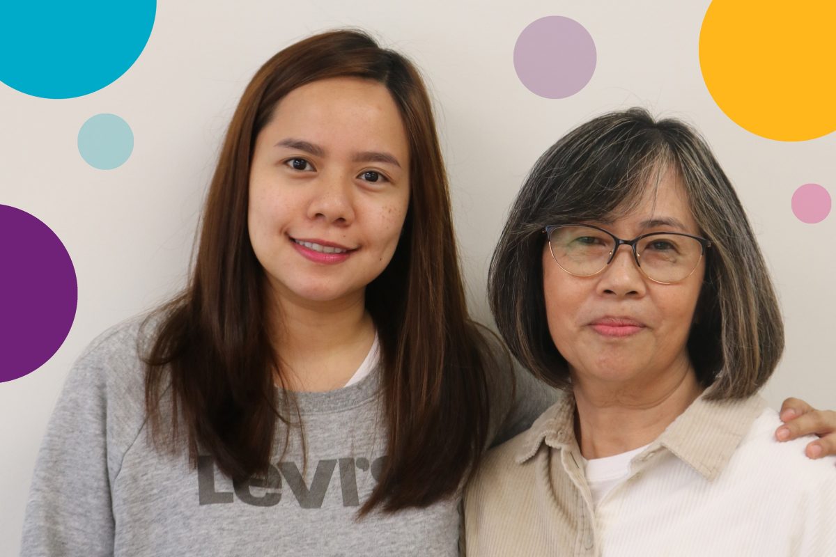Two women of different ages smiling, with colorful circles in the background.
