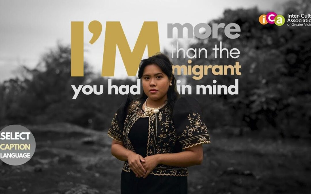 A woman in traditional clothing poses in front of text reading "I'm more than the migrant you had in mind".