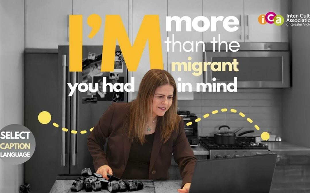 A woman is looking at a laptop in a kitchen with text that reads "I'm more than the migrant you had in mind".